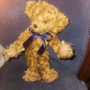 Charming Tan Teddy Bear with Navy Ribbon